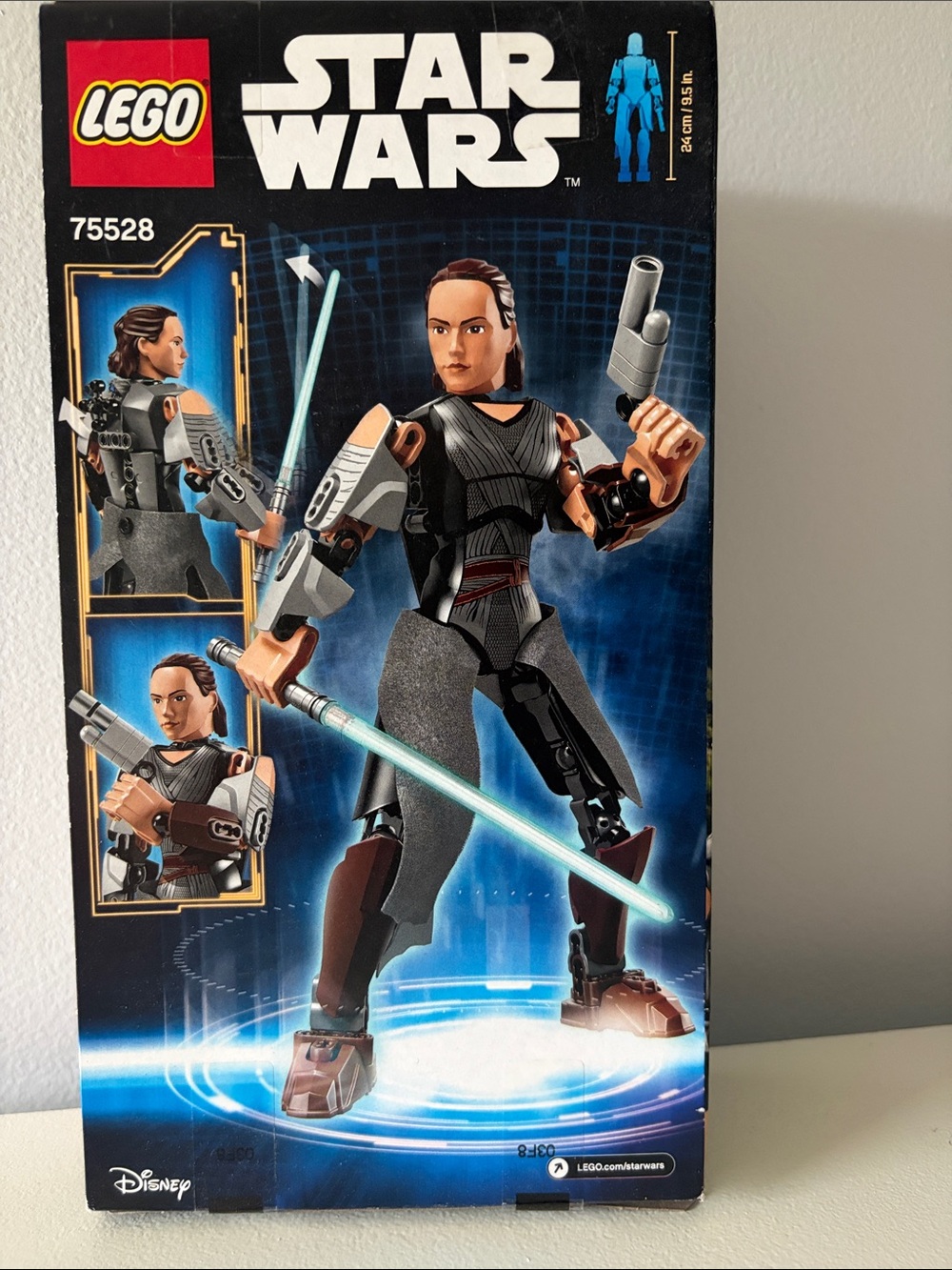 Lego Star Wars Rey Figure with Light Blue Lightsaber and Brown Armor Accents